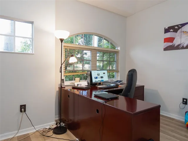 a view of a roof deck with couches and potted plants