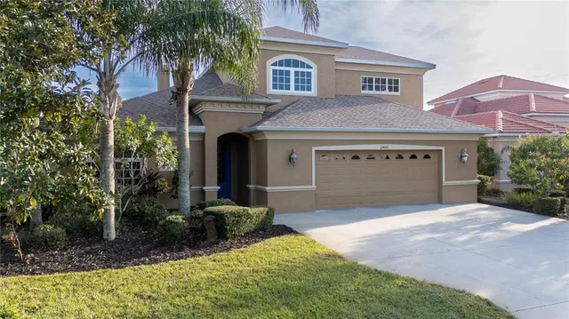 an aerial view of a house with a lake view