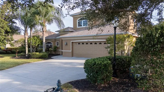 an aerial view of a house with a lake view