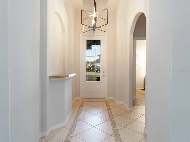 a view of a hallway to rooms