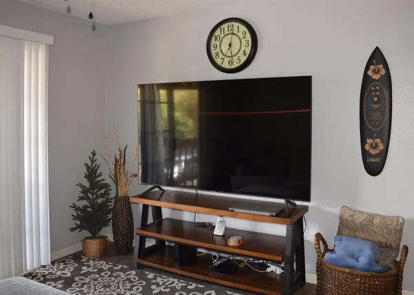 a room with furniture and a potted plant