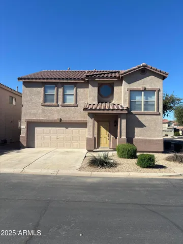 a front view of a house with a garage