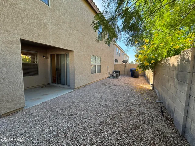 a view of a house with a tree
