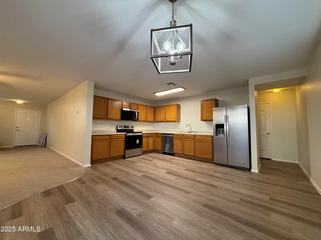 a view of kitchen with wooden floor