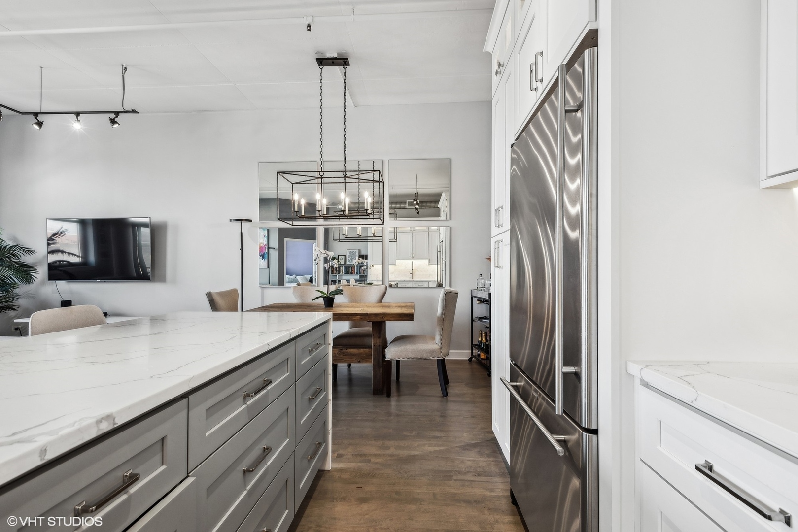 1301 West Madison Street, Unit 501 Chicago, IL 60607 - Photo 12 of 30 a kitchen with stainless steel appliances granite countertop a refrigerator and a sink