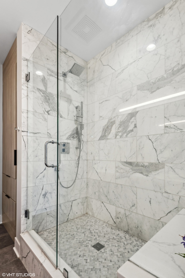 1301 West Madison Street, Unit 501 Chicago, IL 60607 - Photo 18 of 30 a bathroom with a glass shower door