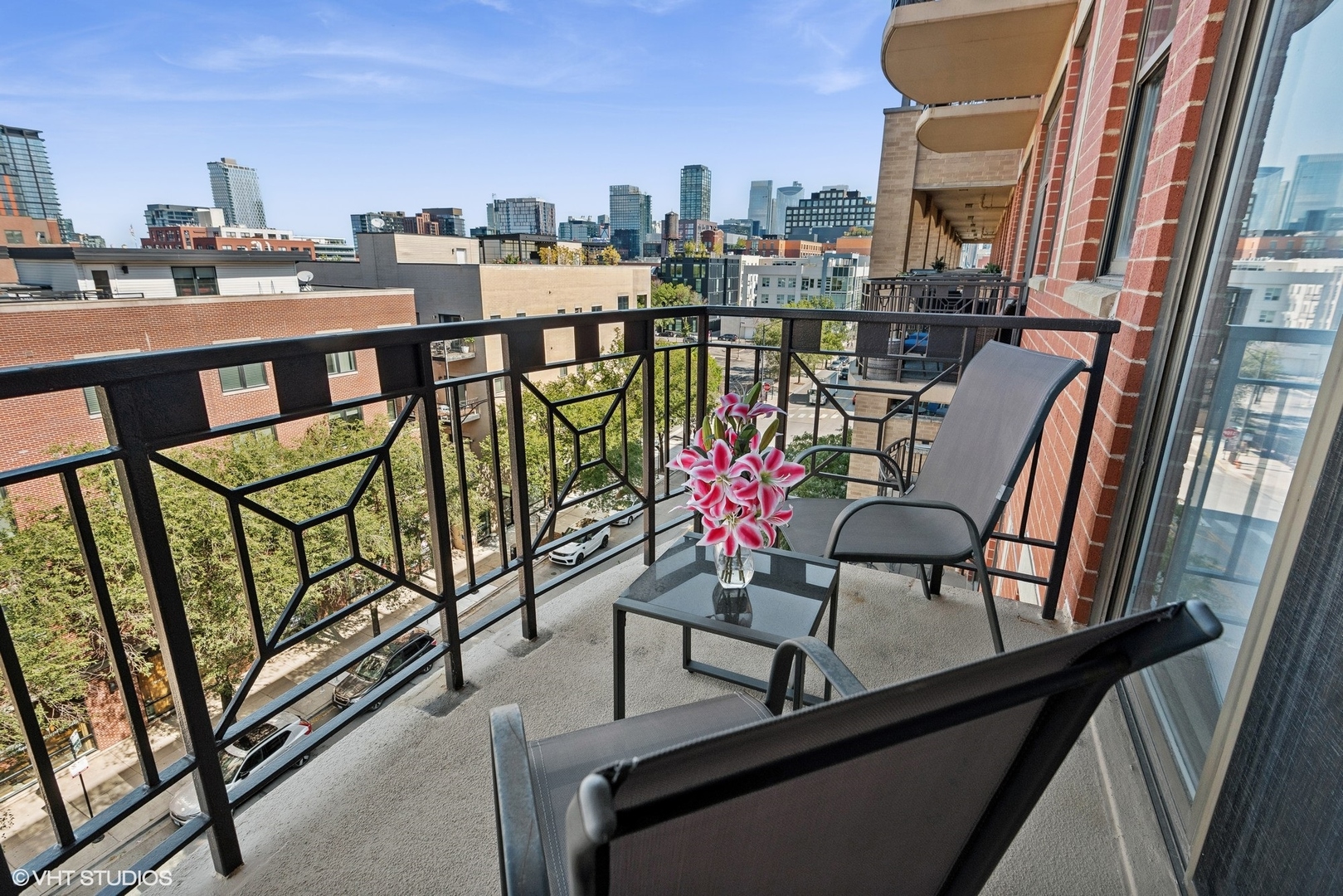 1301 West Madison Street, Unit 501 Chicago, IL 60607 - Photo 22 of 30 a view of a chairs and table in the balcony