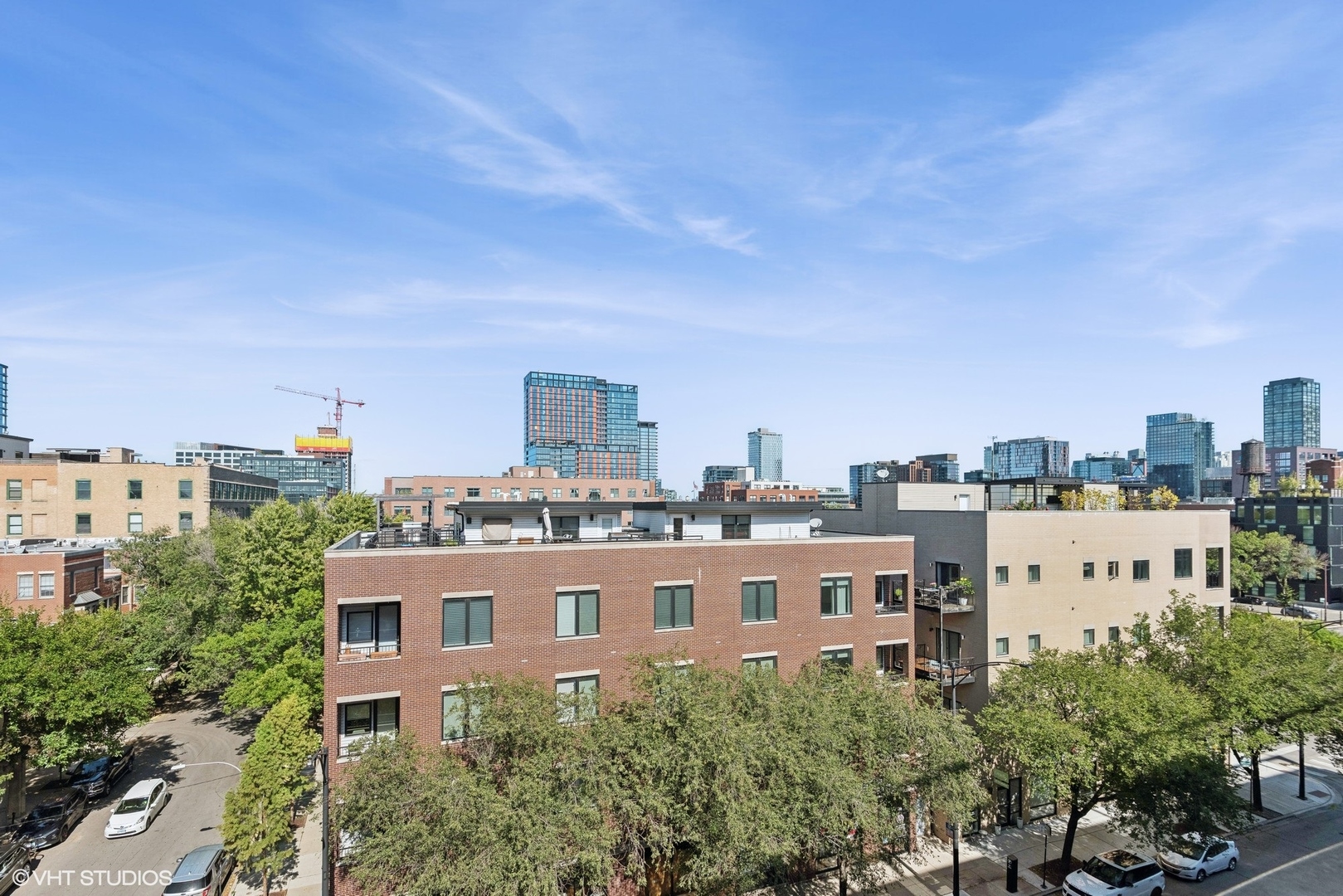 1301 West Madison Street, Unit 501 Chicago, IL 60607 - Photo 25 of 30 a view of a city with tall buildings