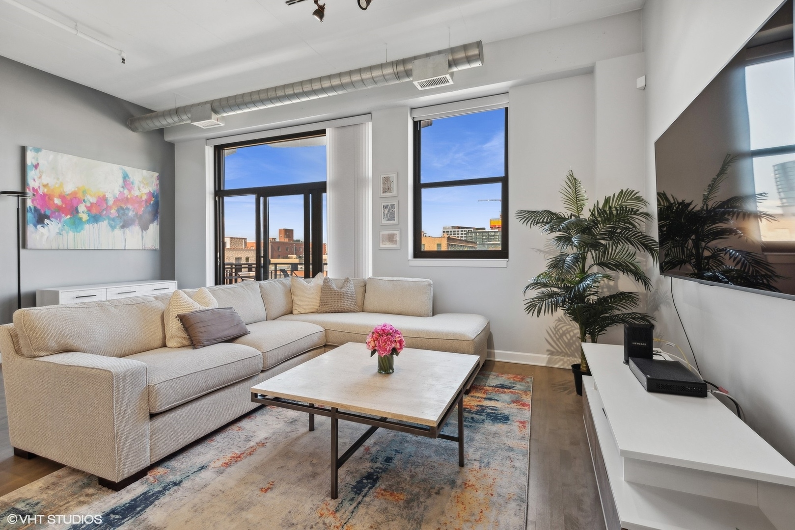 1301 West Madison Street, Unit 501 Chicago, IL 60607 - Photo 3 of 30 a living room with furniture plant and a window
