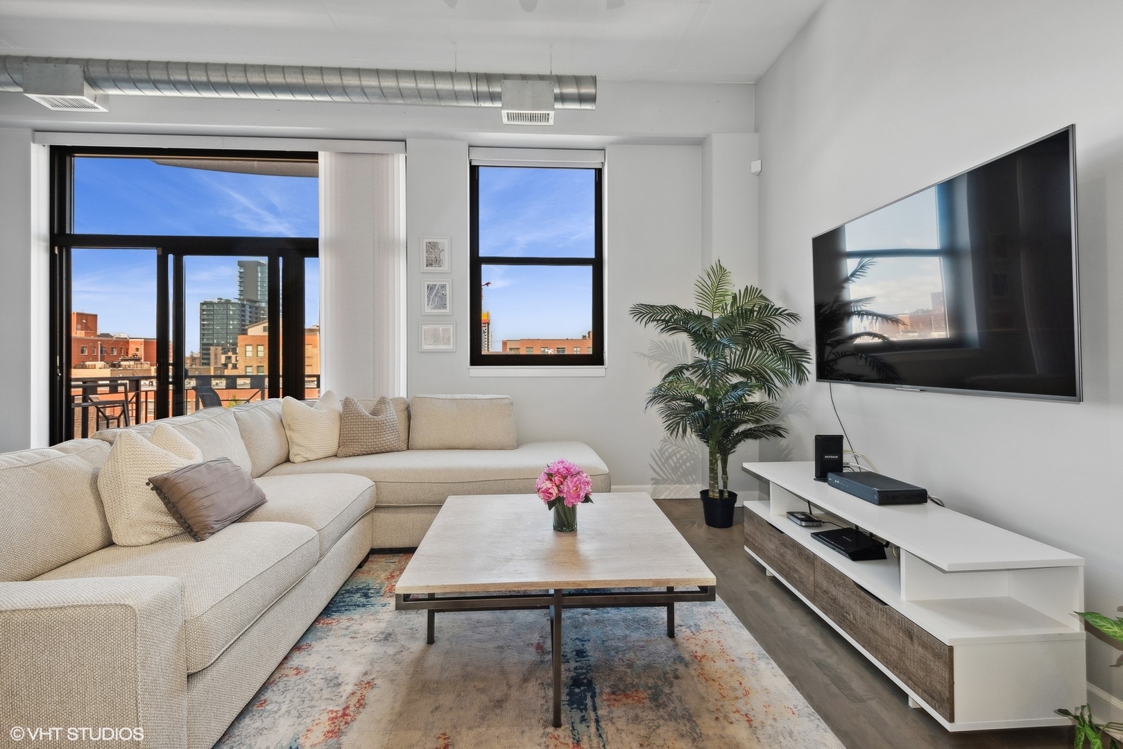 1301 West Madison Street, Unit 501 Chicago, IL 60607 - Photo 4 of 30 a living room with furniture and a flat screen tv