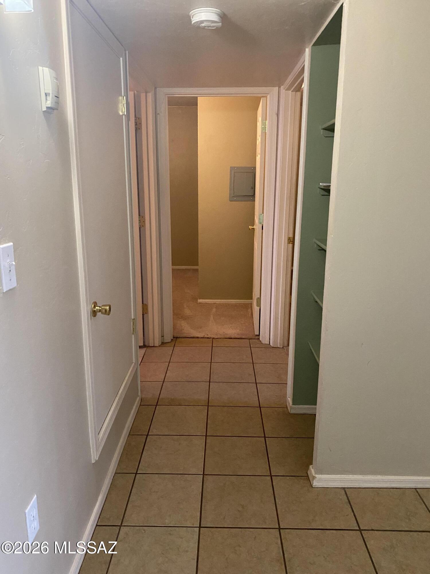 350 North Silverbell Road, Unit 94 Tucson, AZ 85745 - Photo 5 of 15 a view of a hallway