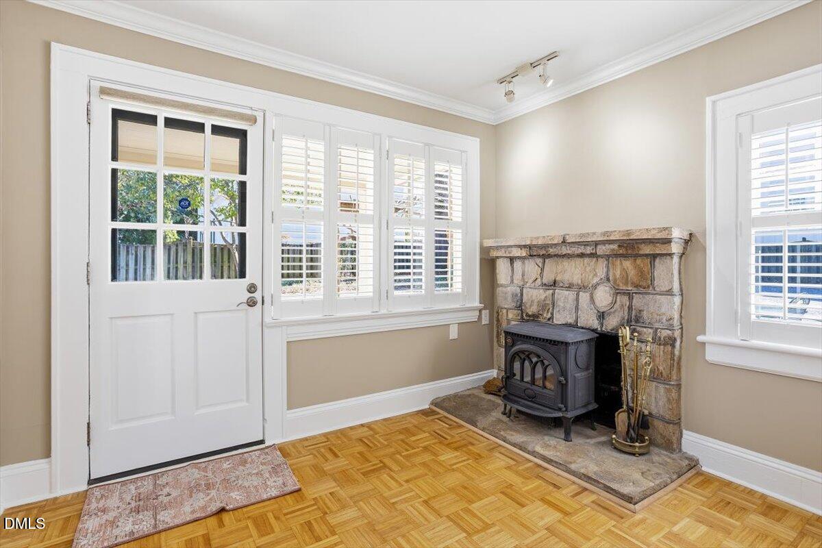 2609 Davis Street Raleigh, NC 27608 - Photo 14 of 31 a living room with fireplace furniture and a window