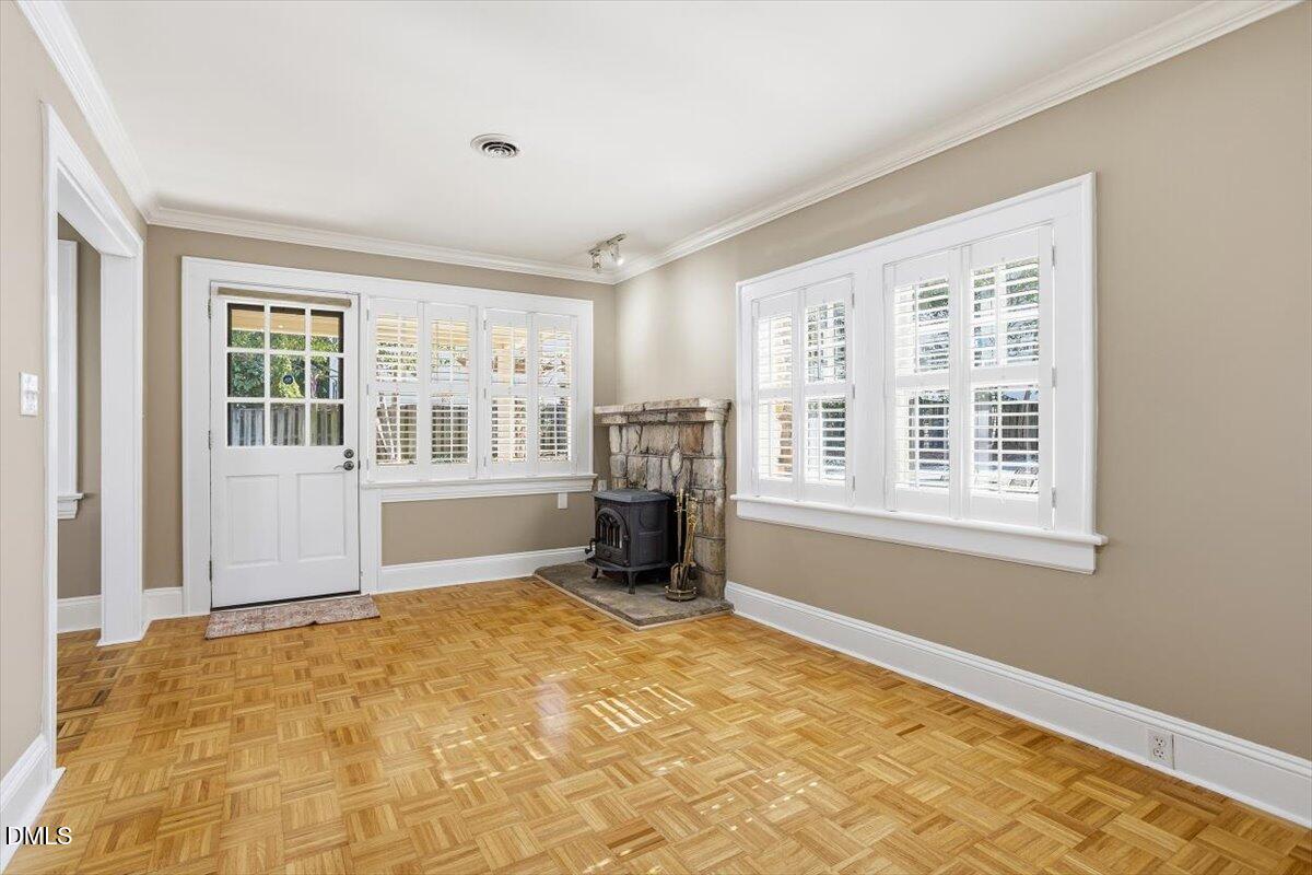 2609 Davis Street Raleigh, NC 27608 - Photo 15 of 31 a view of an empty room with a fireplace