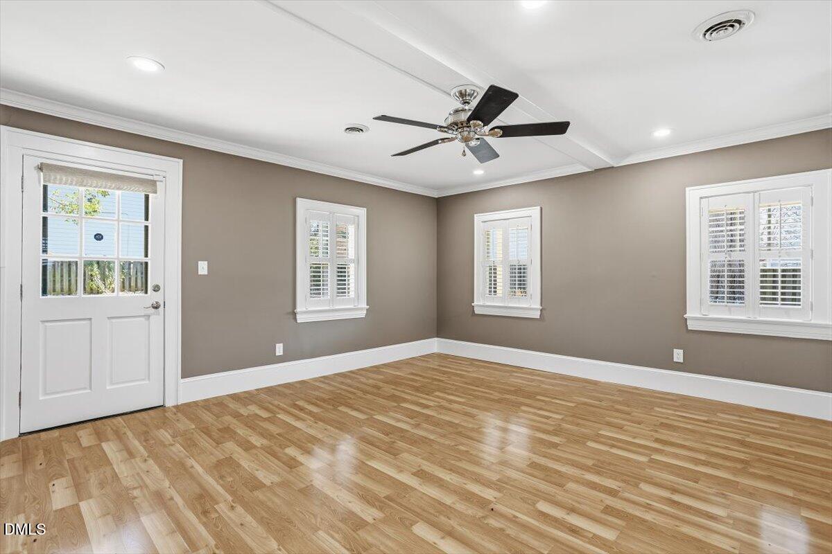2609 Davis Street Raleigh, NC 27608 - Photo 25 of 31 a view of an empty room with window and wooden floor
