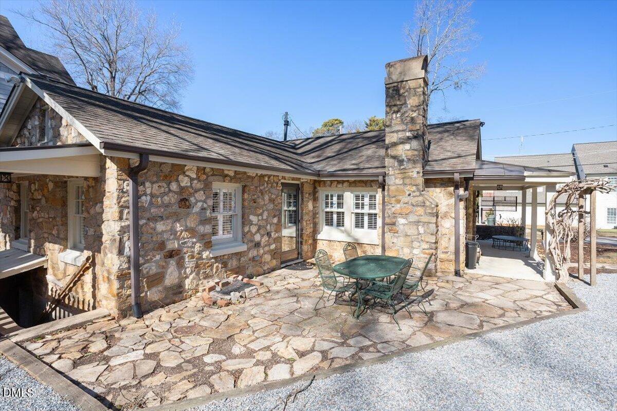 2609 Davis Street Raleigh, NC 27608 - Photo 4 of 31 a view of a patio with couches table and chairs and potted plants