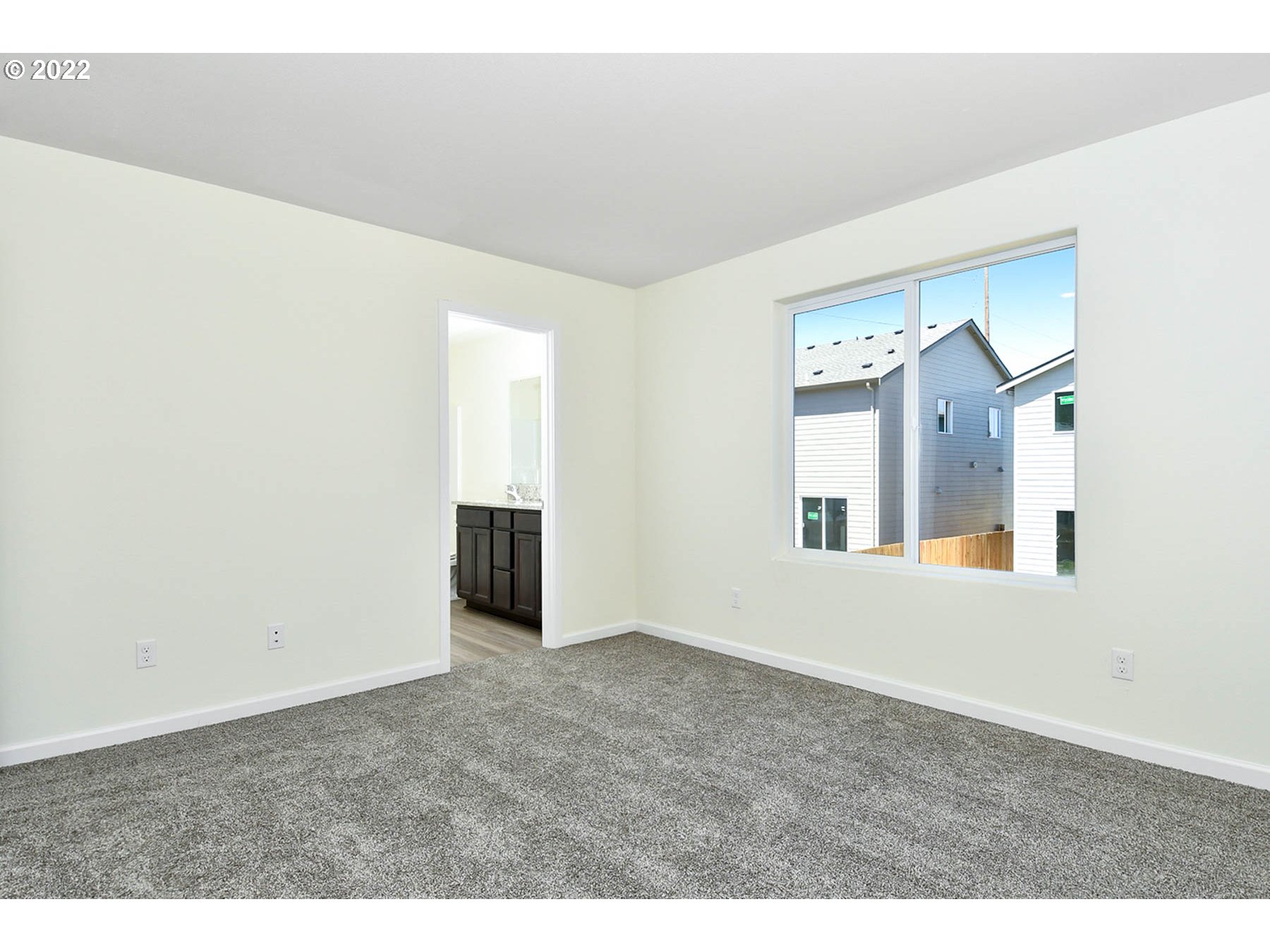 4149 Southwest Hartley Avenue Gresham, OR 97080 - Photo 5 of 8 an empty room with a fireplace and mirror
