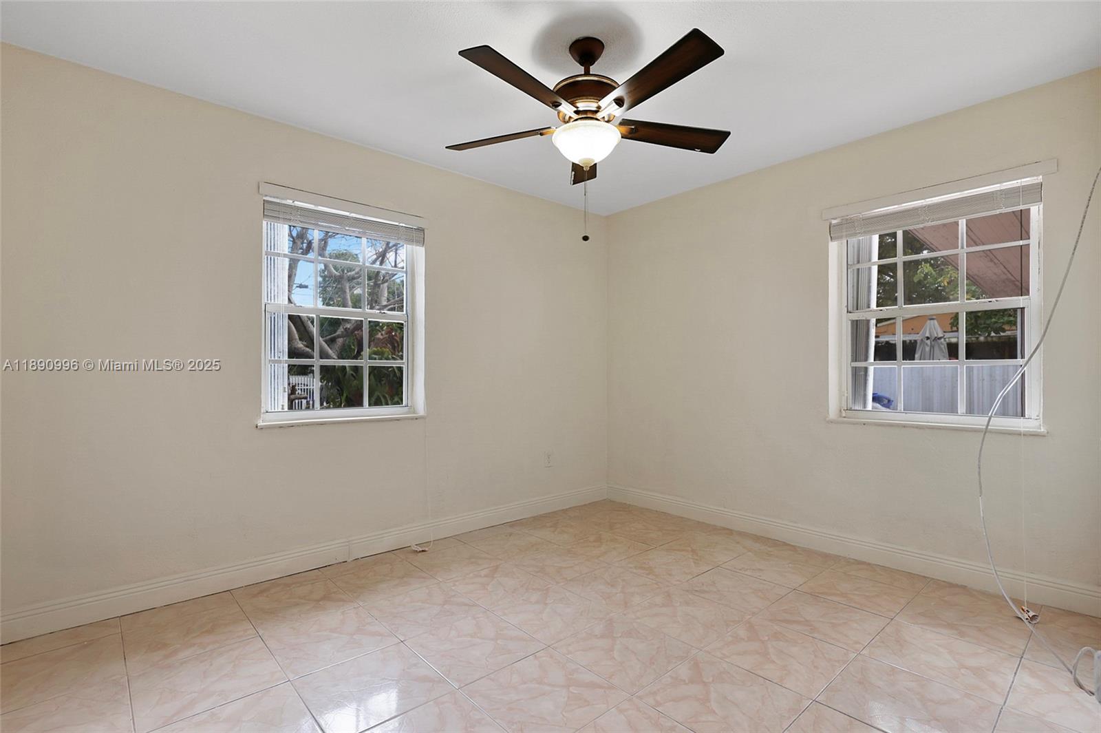 450 Northwest 40th Court Miami, FL 33126 - Photo 13 of 18 an empty room with a window