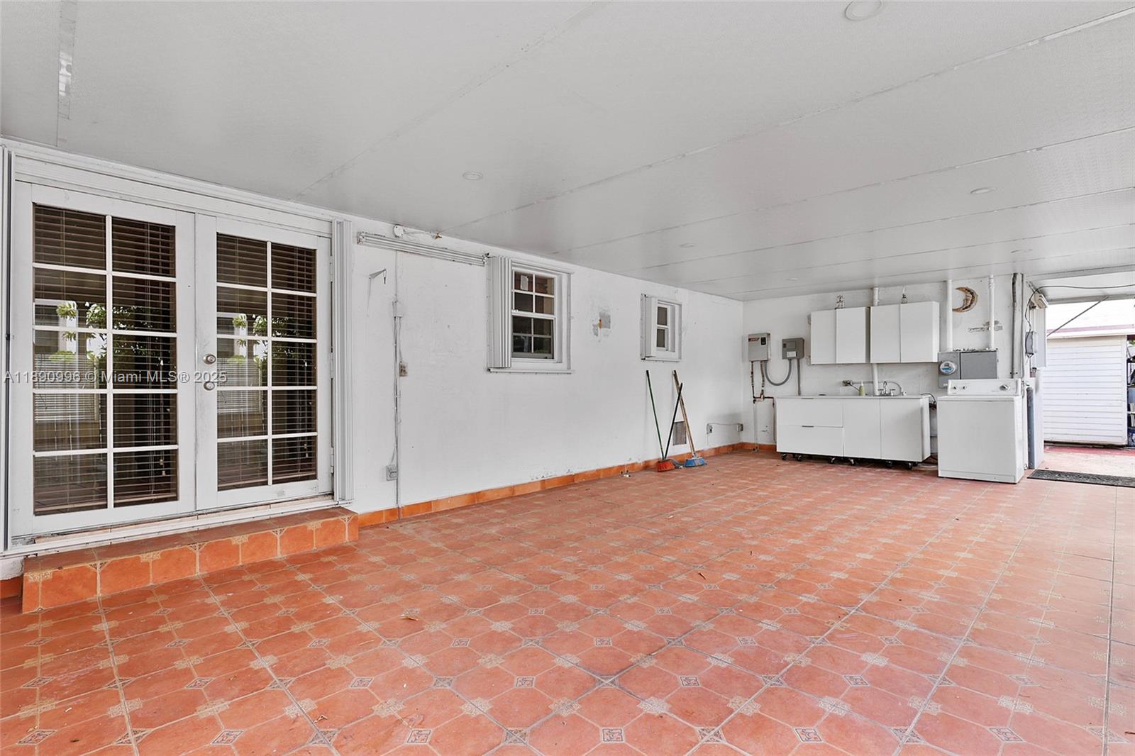 450 Northwest 40th Court Miami, FL 33126 - Photo 16 of 18 a view of an empty room with a window