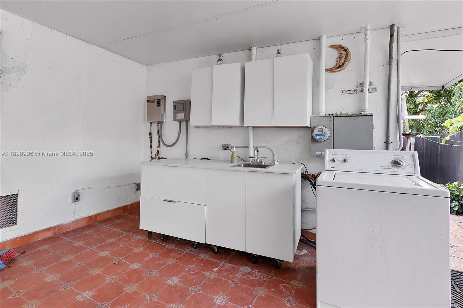 450 Northwest 40th Court Miami, FL 33126 - Photo 17 of 18 a view of utility room with washer and dryer