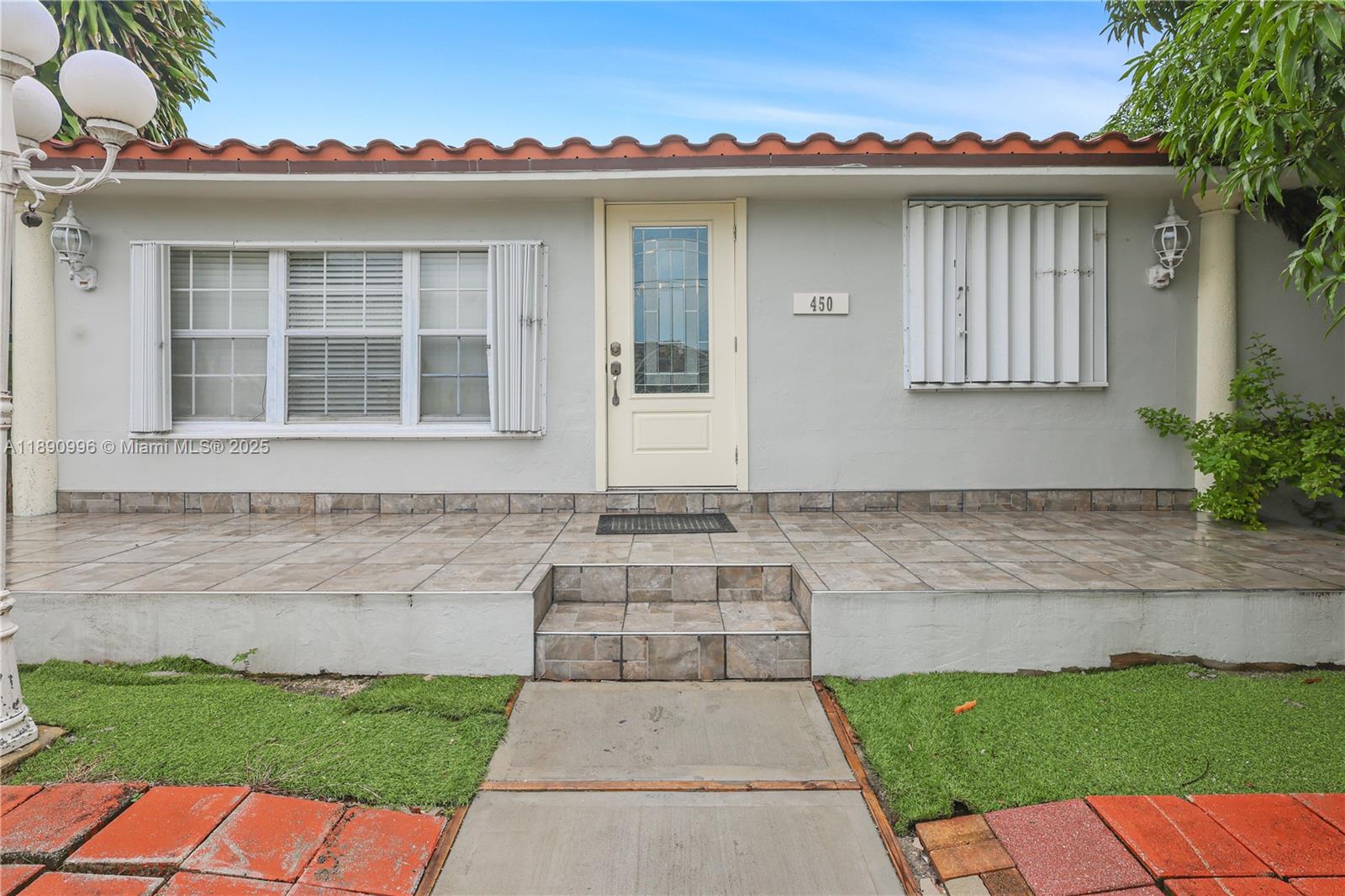 450 Northwest 40th Court Miami, FL 33126 - Photo 2 of 18 front view of a house