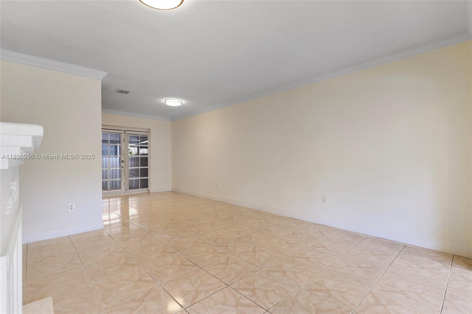 450 Northwest 40th Court Miami, FL 33126 - Photo 6 of 18 a view of an empty room with a window