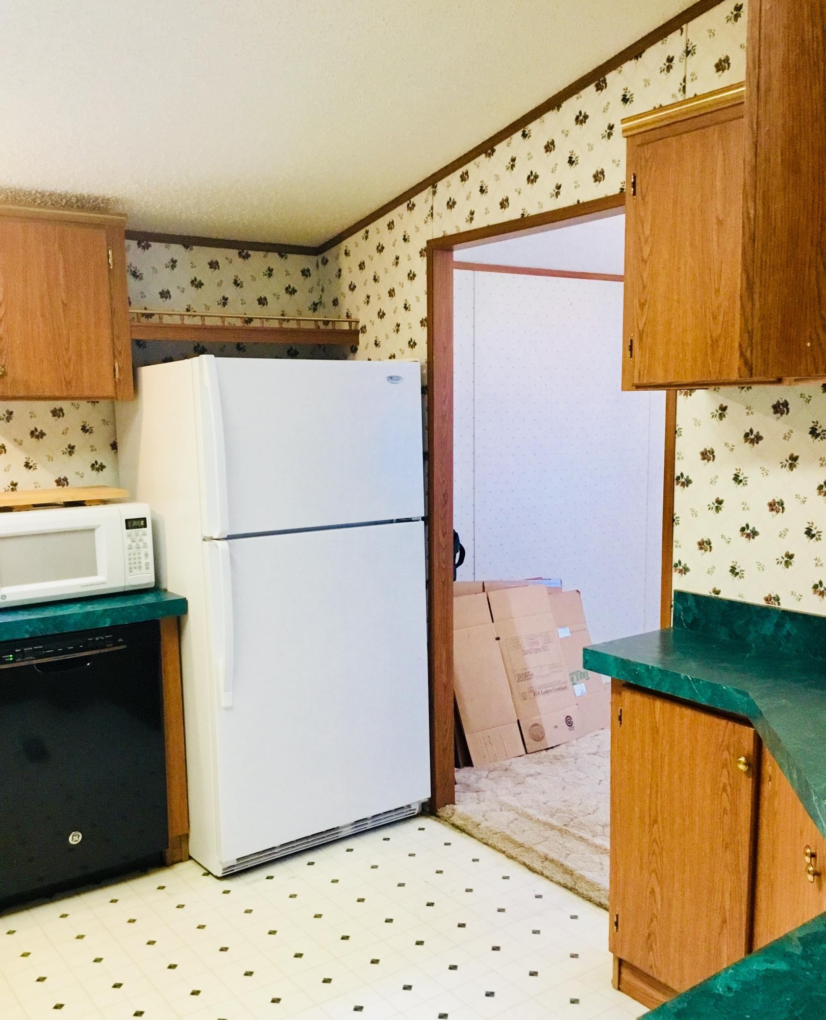 913 Rabbit Ranch Lane, Unit 23 Decatur, TN 37322 - Photo 21 of 32 a bathroom with a refrigerator and a stove