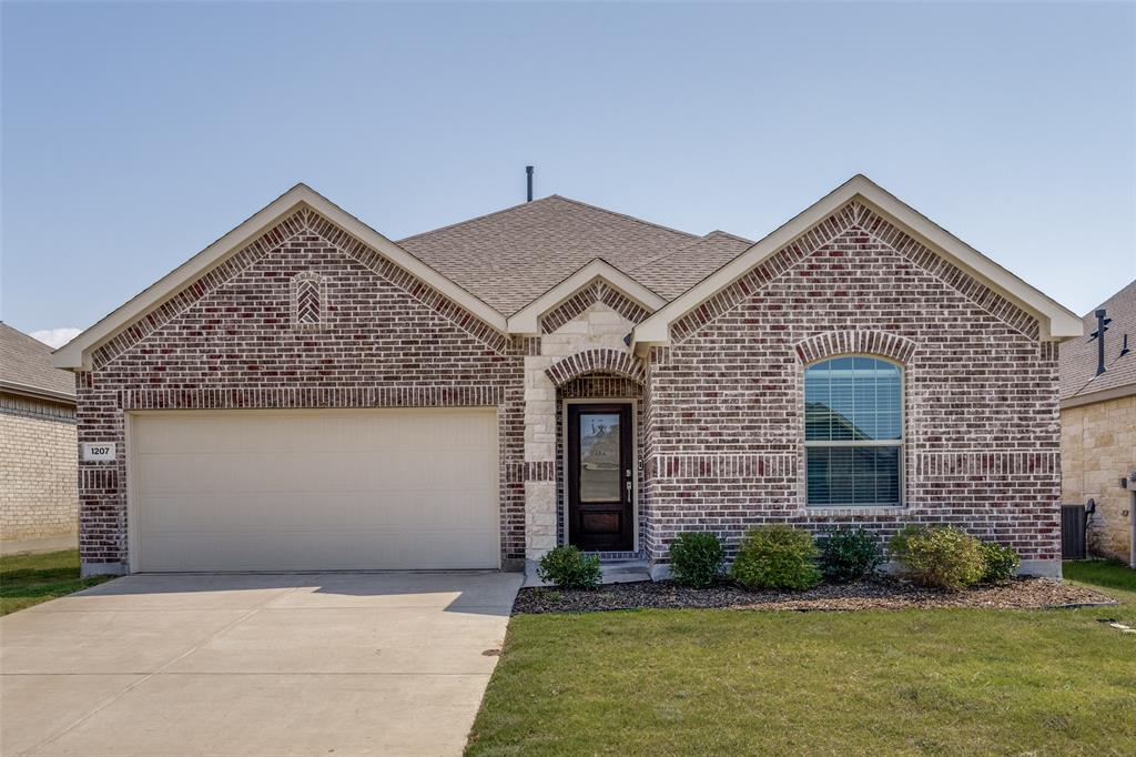 1207 Mesquite Lane Princeton, TX 75407 - Photo 1 of 25 a front view of a house with garden