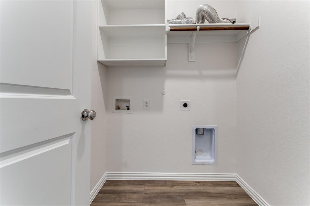 1207 Mesquite Lane Princeton, TX 75407 - Photo 15 of 25 a view of storage and utility room with wooden floor