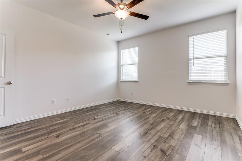 1207 Mesquite Lane Princeton, TX 75407 - Photo 19 of 25 wooden floor in an empty room with a window