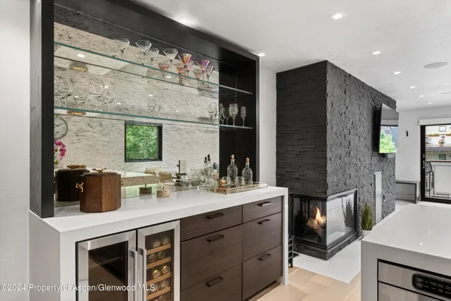 a kitchen with a sink and a refrigerator