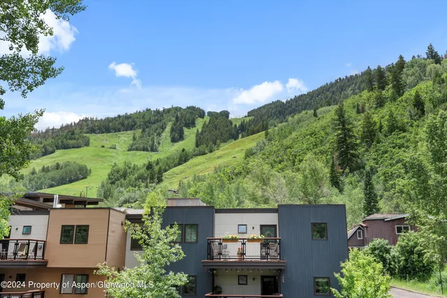 an aerial view of house with yard