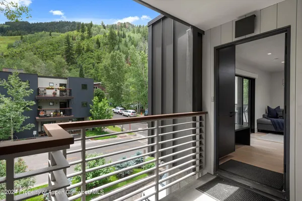 a view of balcony with furniture