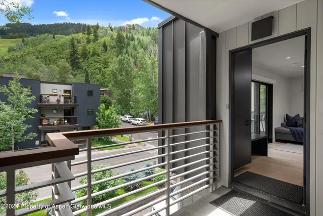 a view of balcony with furniture