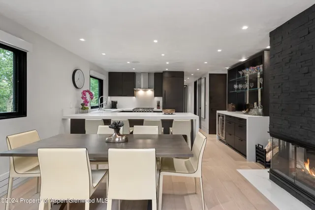 a large kitchen with a table and chairs