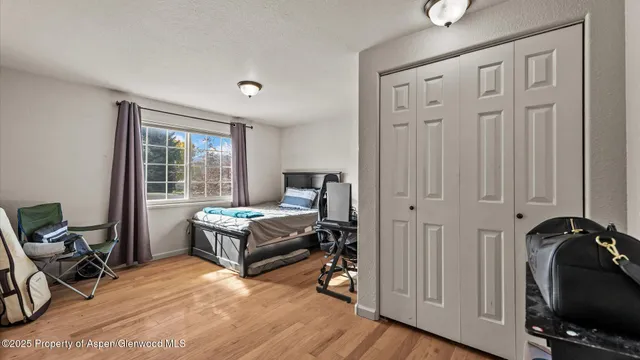 a bedroom with furniture and a window