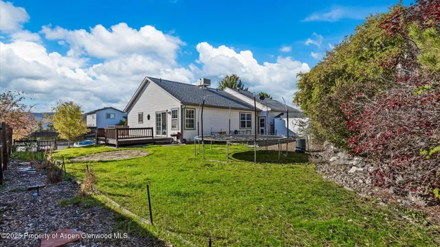 a aerial view of a house with yard and swimming pool