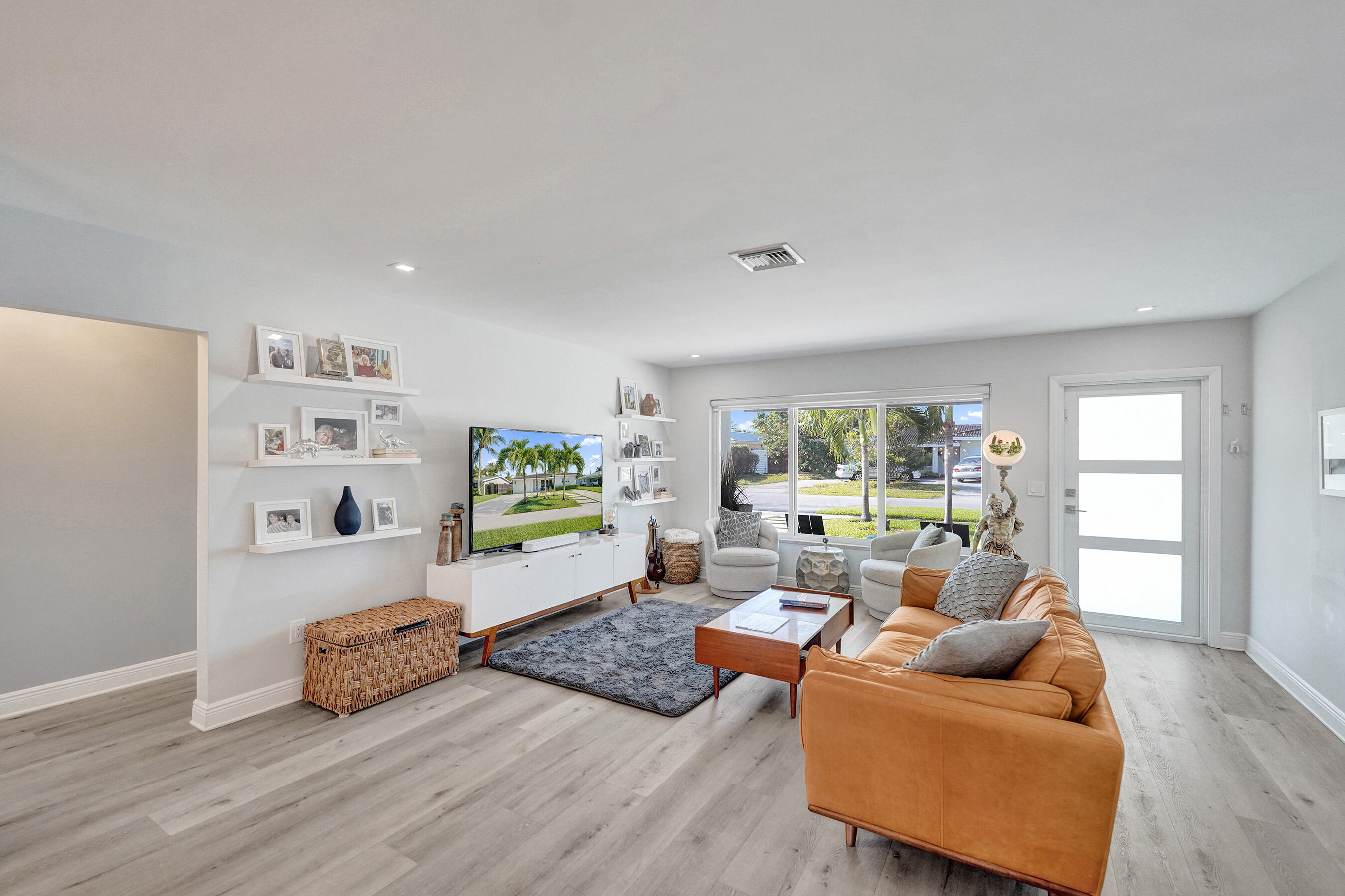 381 Southeast 3rd Street Pompano Beach, FL 33060 - Photo 7 of 41 a living room with furniture and a large window