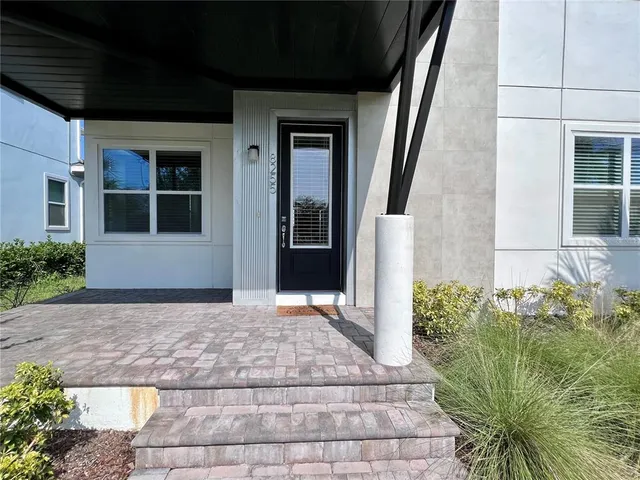 a kitchen with stainless steel appliances granite countertop a sink a stove and a refrigerator
