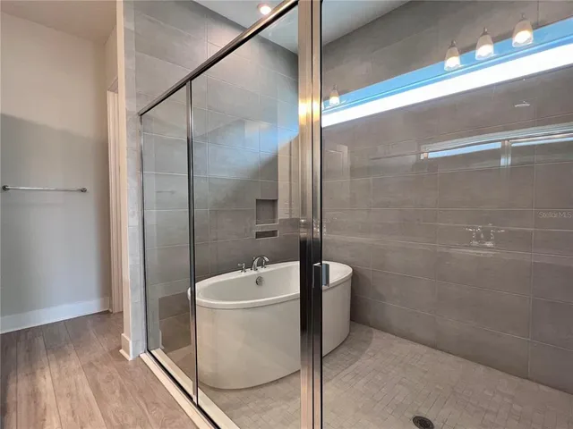 a view of an empty room and a window