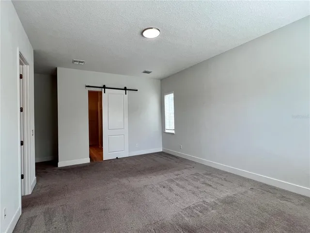 a view of gallery with wooden floor