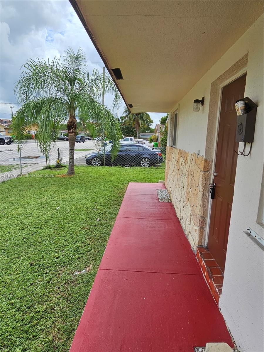 5820 Northwest 19th Street, Unit B Sunrise, FL 33313 - Photo 1 of 15 a view of a backyard with potted plants