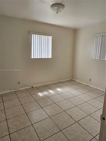 a view of a livingroom and window