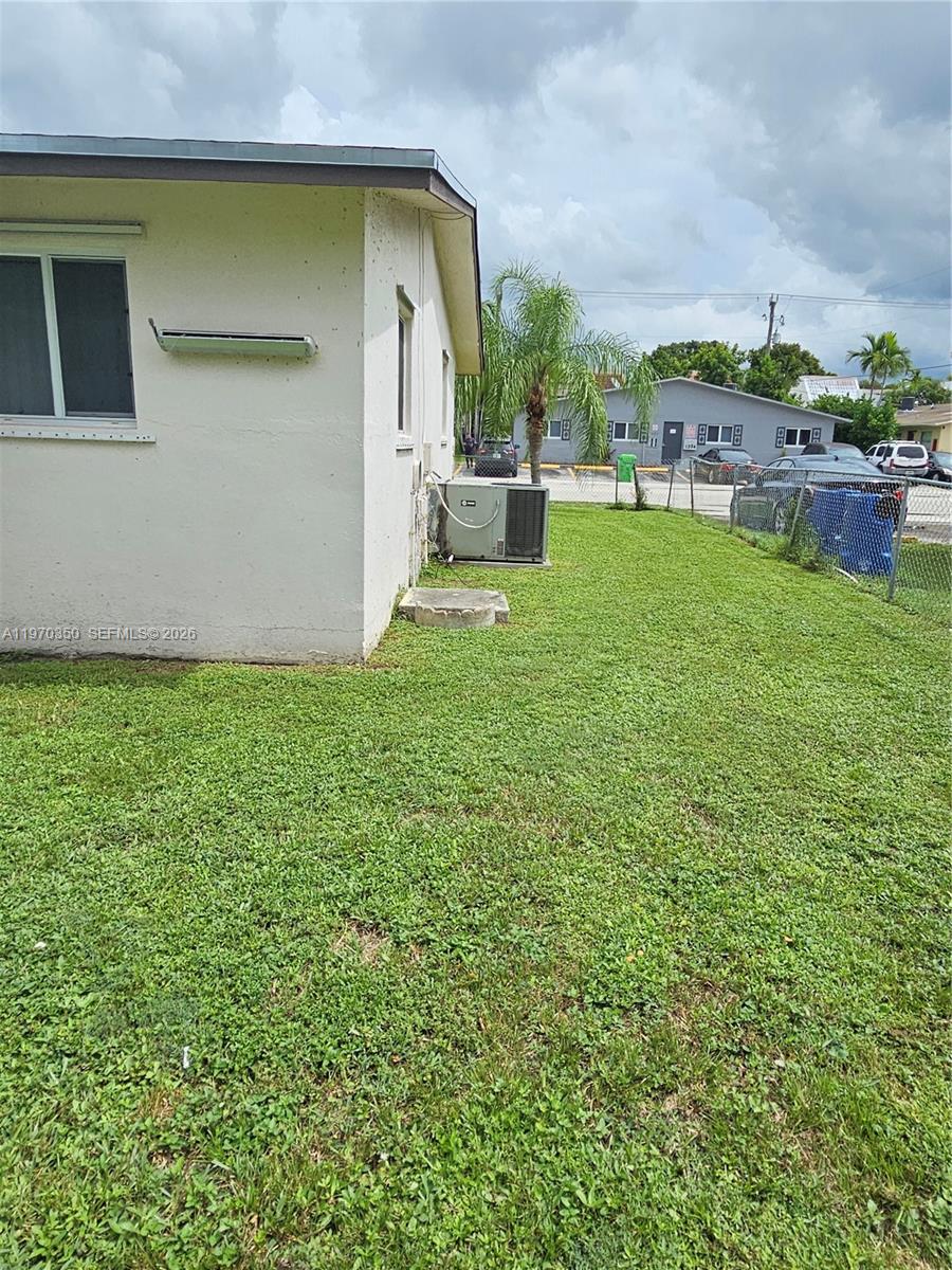 5820 Northwest 19th Street, Unit B Sunrise, FL 33313 - Photo 12 of 15 a backyard of a house with table and chairs