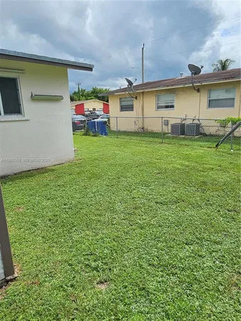 a big room with plants and large trees