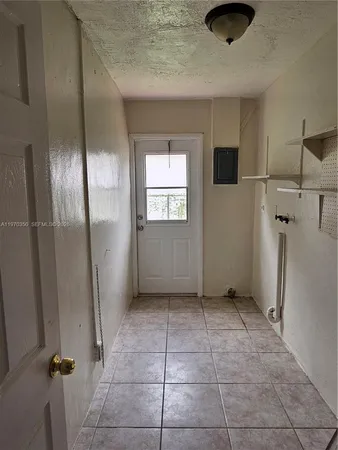 a view of a livingroom with a kitchen