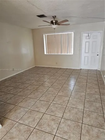 a view of an empty room and window