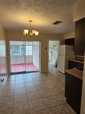 a view of a livingroom with kitchen