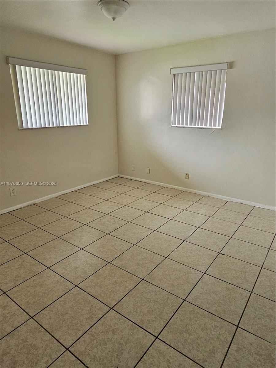 5820 Northwest 19th Street, Unit B Sunrise, FL 33313 - Photo 10 of 15 a view of an empty room and window