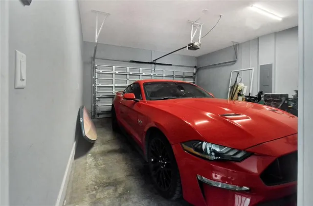 a balcony with furniture and a potted plant