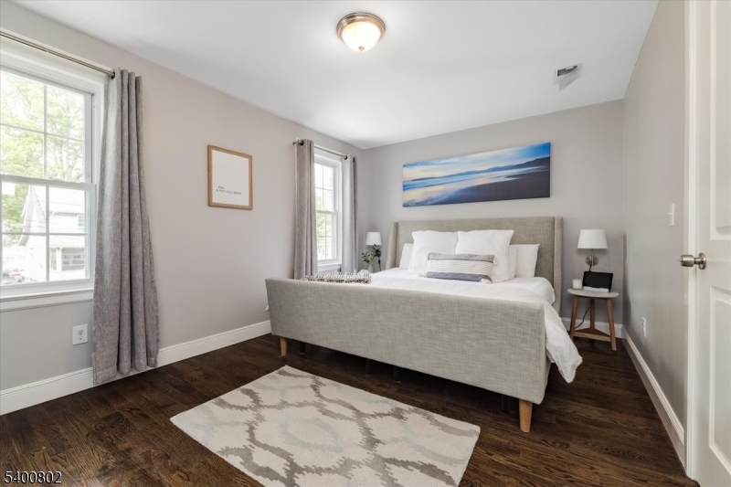 66 Hughes Street Maplewood, NJ 07040 - Photo 10 of 18 a bedroom with a bed and wooden floor